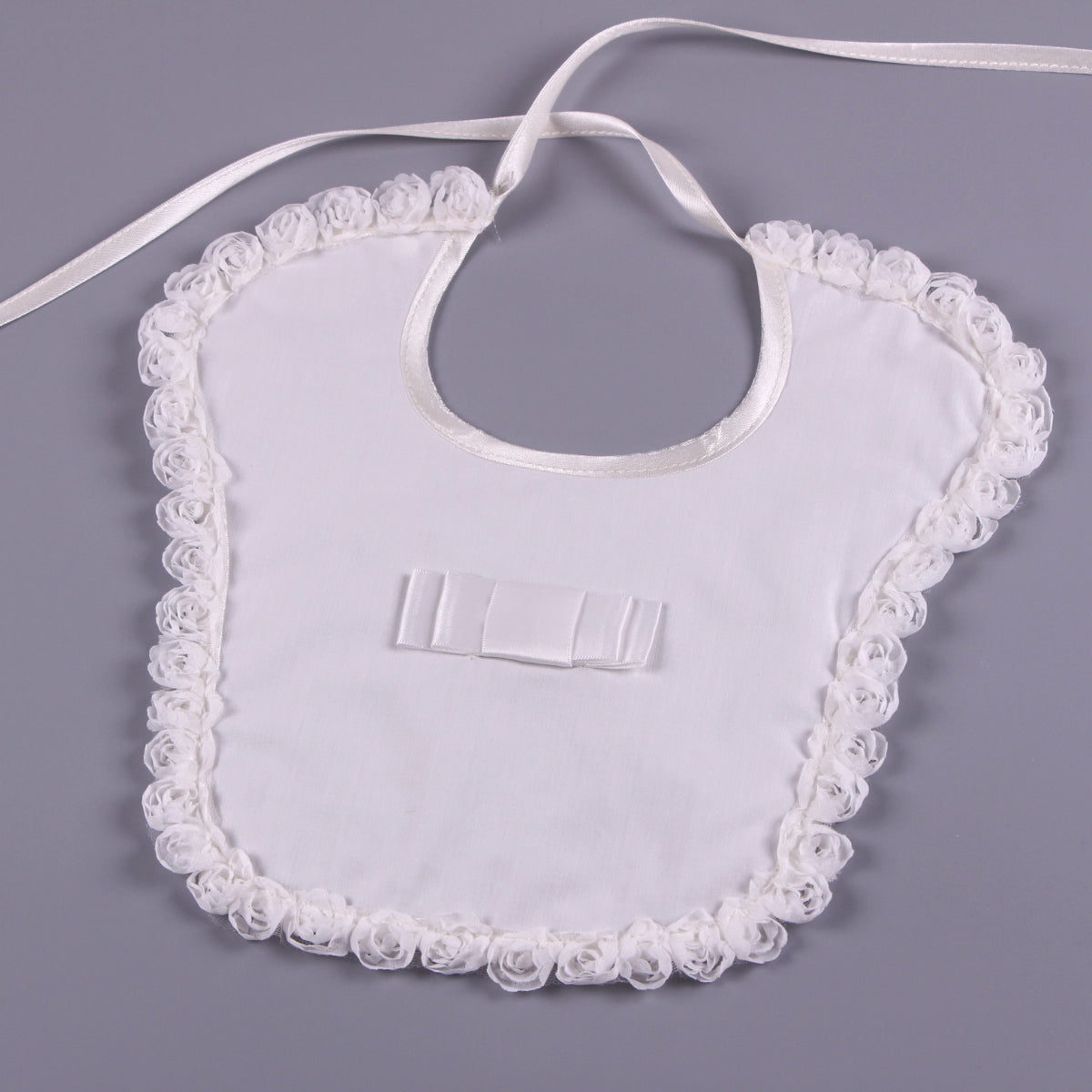 White lace-trimmed  on a gray background