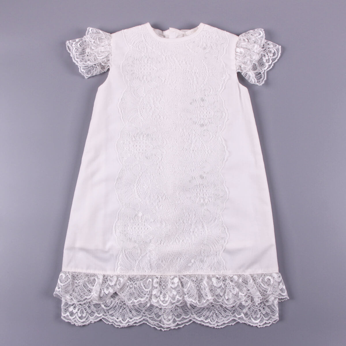 White lace dress on a gray background
