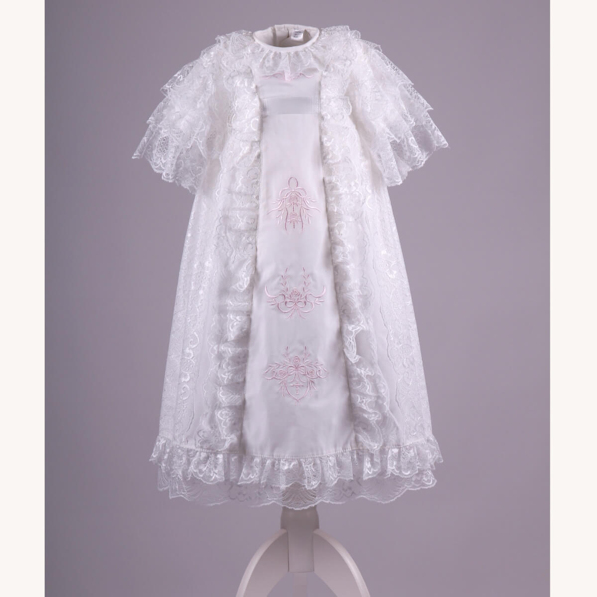 Christening Gown for Girls with pink embroidery on a gray background