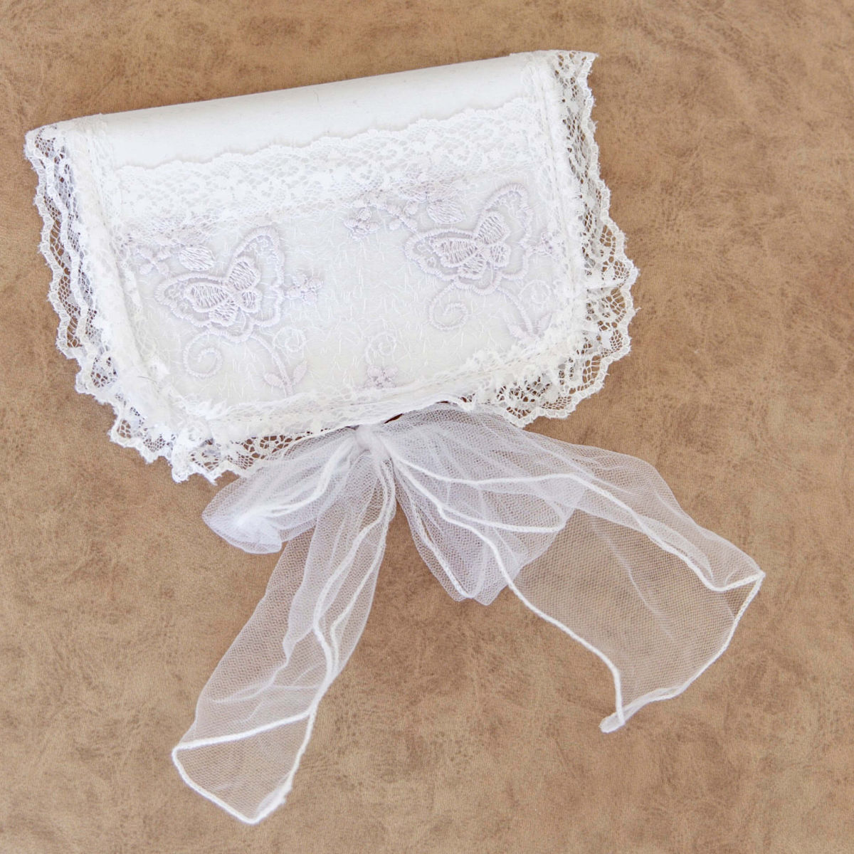 First Curl Keepsake Box with a bow on a brown background