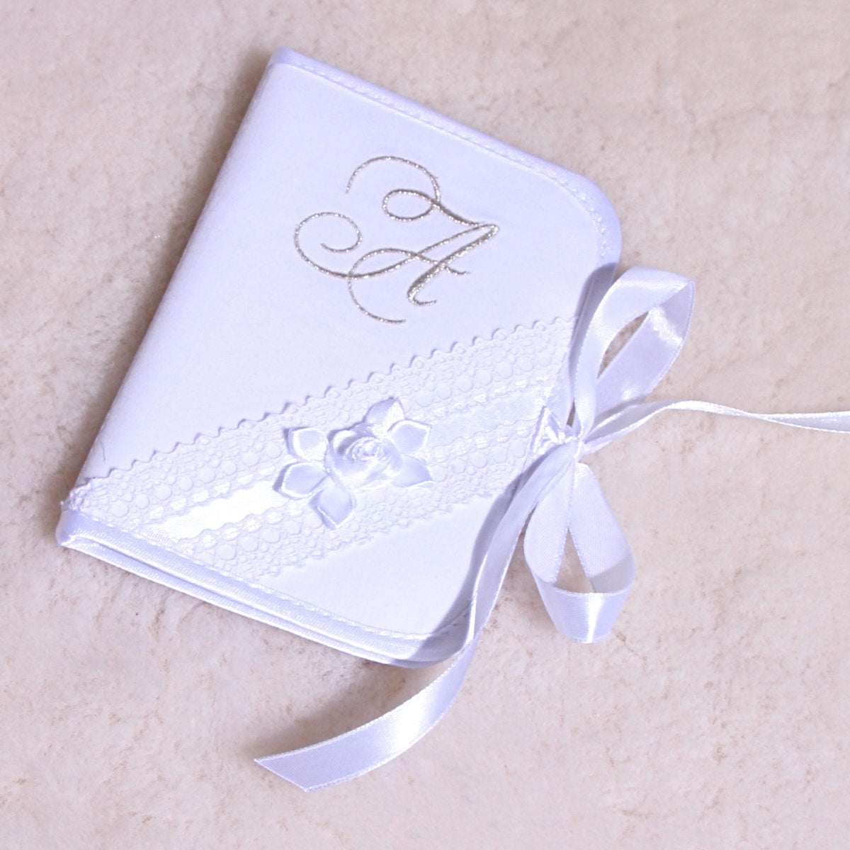 Baptism Keepsake Box with a ribbon on a beige background